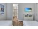 Bright bedroom showcasing a mounted TV and ensuite bathroom access at 7519 Marker Ave, Kissimmee, FL 34747