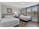 Bedroom with two beds, wood-look floors and window at 7519 Marker Ave, Kissimmee, FL 34747
