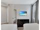 Bedroom with two twin beds, dark dresser with TV, and an ensuite bathroom at 7519 Marker Ave, Kissimmee, FL 34747