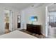 Cozy bedroom with a television and easy access to the ensuite bathroom at 7519 Marker Ave, Kissimmee, FL 34747