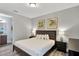 Spacious bedroom with a large bed and a connected bathroom at 7519 Marker Ave, Kissimmee, FL 34747