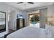 Serene bedroom with direct access to the outdoor pool area through sliding glass doors at 7519 Marker Ave, Kissimmee, FL 34747