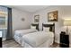 Cozy bedroom featuring twin beds with nautical themed art and a nightstand at 7519 Marker Ave, Kissimmee, FL 34747