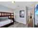 Bedroom featuring bunk beds, wood-look floors and closet at 7519 Marker Ave, Kissimmee, FL 34747