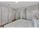 Neutral colored bedroom showcasing a queen bed and adjoining closets at 7519 Marker Ave, Kissimmee, FL 34747