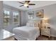Bright bedroom with large windows, neutral decor, and a comfortable queen-size bed at 7519 Marker Ave, Kissimmee, FL 34747