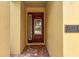 Elegant front door with glass detailing and address plaque, creating a welcoming entrance at 7519 Marker Ave, Kissimmee, FL 34747
