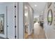 Bright hallway with wood floors leading to an open-concept living area at 7519 Marker Ave, Kissimmee, FL 34747