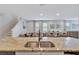 Open kitchen view showcasing granite countertops and seamlessly connecting to the dining area at 7519 Marker Ave, Kissimmee, FL 34747