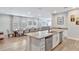 Spacious open-concept kitchen that connects to a dining area with plenty of natural light at 7519 Marker Ave, Kissimmee, FL 34747
