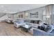 Spacious living room with an L-shaped sofa, a coffee table, and a dining area at 7519 Marker Ave, Kissimmee, FL 34747