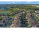 A neighborhood is captured from above, revealing lush backyards, swimming pools, and serene landscaping around the homes at 7643 Wilmington Loop, Kissimmee, FL 34747