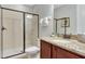 Bathroom features granite countertops, wood cabinet vanity, and a glass-enclosed shower at 7643 Wilmington Loop, Kissimmee, FL 34747