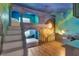 Unique themed bedroom with playful bunkbeds, creative murals, and custom design elements at 7643 Wilmington Loop, Kissimmee, FL 34747