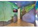 room featuring creative bunk beds, themed murals, a mounted TV, and custom design at 7643 Wilmington Loop, Kissimmee, FL 34747