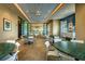 A well-appointed common area features modern decor, neutral tones, and a comfortable seating arrangement for relaxation at 7643 Wilmington Loop, Kissimmee, FL 34747