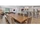 Open floor plan with a long dining table with access to kitchen and living room; perfect for entertaining at 7643 Wilmington Loop, Kissimmee, FL 34747