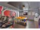 Spacious game room featuring Star Wars themed wall art, arcade games, and entertainment center at 7643 Wilmington Loop, Kissimmee, FL 34747
