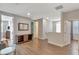 Open hallway area with wood-style floors, leading to other rooms at 7643 Wilmington Loop, Kissimmee, FL 34747