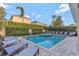 Beautiful pool and spa area with ample lounge seating and lush landscaping for privacy at 7643 Wilmington Loop, Kissimmee, FL 34747