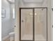 Bathroom featuring a glass shower and a toilet at 7643 Wilmington Loop, Kissimmee, FL 34747