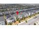 Aerial view of the property in a neighborhood with well-maintained homes, showcasing community layout at 780 Drop Shot Dr, Davenport, FL 33896