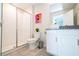 Modern bathroom featuring a glass-enclosed shower, white cabinets, and gray countertop at 780 Drop Shot Dr, Davenport, FL 33896