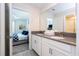Open bathroom with double sink vanity, ensuite bedroom view and access to toilet at 780 Drop Shot Dr, Davenport, FL 33896