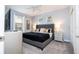 Cozy bedroom with a tufted headboard, stylish bedding, and coordinated nightstands at 780 Drop Shot Dr, Davenport, FL 33896