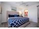 Neutral bedroom with queen bed, ceiling fan and ensuite bathroom at 780 Drop Shot Dr, Davenport, FL 33896