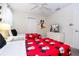 Themed bedroom featuring twin beds with bright red Mickey Mouse comforters and a TV at 780 Drop Shot Dr, Davenport, FL 33896