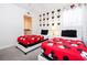 Cozy bedroom featuring twin beds with themed comforters and access to the bathroom at 780 Drop Shot Dr, Davenport, FL 33896