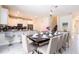 Dining area with seating for eight adjacent to the kitchen at 780 Drop Shot Dr, Davenport, FL 33896