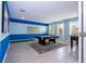 Spacious game room with pool table and foosball, perfect for Gathering fun and entertainment at 780 Drop Shot Dr, Davenport, FL 33896