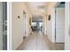 Bright hallway with sleek tile flooring, providing a seamless flow throughout the home at 780 Drop Shot Dr, Davenport, FL 33896