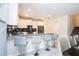 Kitchen with a breakfast bar and stainless steel appliances at 780 Drop Shot Dr, Davenport, FL 33896