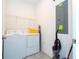 Functional laundry room featuring a washer, dryer, and wire shelving for convenient storage at 780 Drop Shot Dr, Davenport, FL 33896