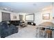 The spacious living room has a projector and large screen for a movie experience at 780 Drop Shot Dr, Davenport, FL 33896