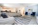 Spacious living room with ample seating and open concept design at 780 Drop Shot Dr, Davenport, FL 33896