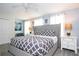 Well lit Main bedroom features a king bed, closet, dresser and bedside tables at 780 Drop Shot Dr, Davenport, FL 33896
