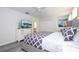 Well lit Main bedroom features a king bed, closet, dresser with TV and bedside tables at 780 Drop Shot Dr, Davenport, FL 33896