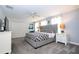 Well lit Main bedroom features a king bed, closet, dresser and bedside tables at 780 Drop Shot Dr, Davenport, FL 33896