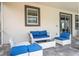 Relaxing outdoor seating area, showcasing comfortable furniture and a stylish design at 780 Drop Shot Dr, Davenport, FL 33896