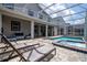 Inviting pool and spa with covered patio, ideal for outdoor relaxation and entertainment at 780 Drop Shot Dr, Davenport, FL 33896