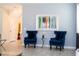 Cozy sitting area with blue armchairs and accent table at 780 Drop Shot Dr, Davenport, FL 33896