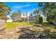 Expansive backyard featuring a screened-in pool and ample green space, perfect for outdoor entertaining and relaxation at 786 Oxford Dr, Davenport, FL 33897