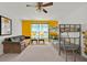 Colorful room featuring bunk beds, a cozy couch, and Minion-themed decor for a fun space at 786 Oxford Dr, Davenport, FL 33897