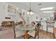 Cozy dining area with a glass table and a view of the living room at 786 Oxford Dr, Davenport, FL 33897