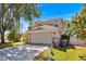 Charming two-story home with a well-maintained lawn and a spacious two-car garage at 786 Oxford Dr, Davenport, FL 33897
