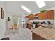 Bright kitchen featuring granite countertops, stainless steel appliances, and a casual dining area at 786 Oxford Dr, Davenport, FL 33897